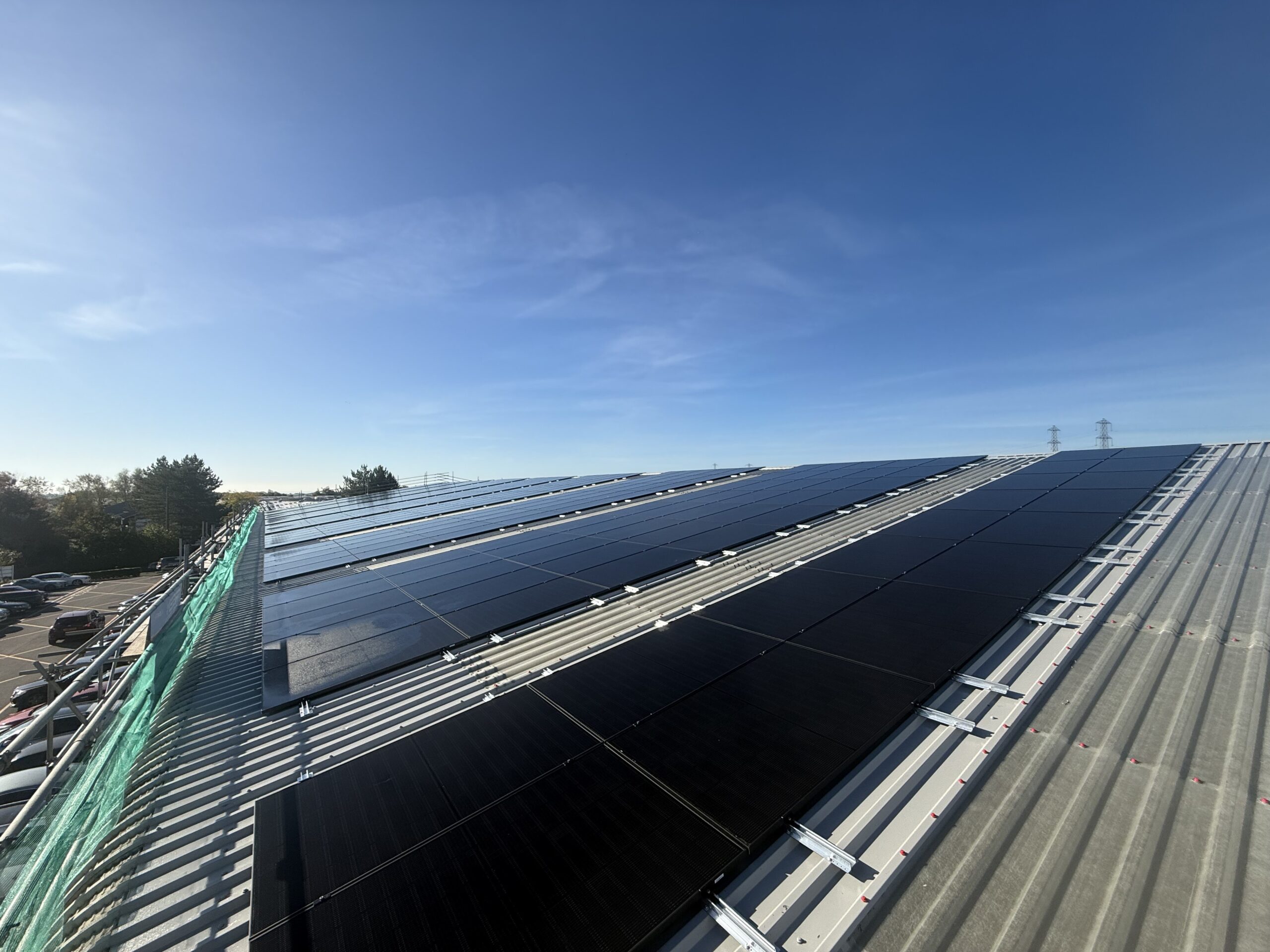 IMG_6546 Newly installed solar PV panels on a refurbished metal roof at Emplas Windows’ Wellingborough manufacturing facility, showing the clean, modern roof system